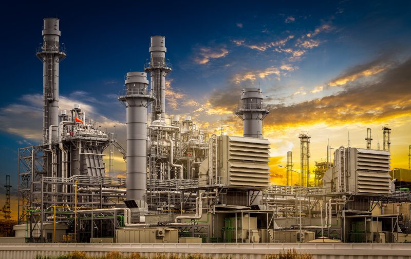 Power plant station building on sunset background